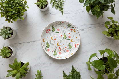 Fairy Folklore Print Trinket on a marble tabletop and around plants
