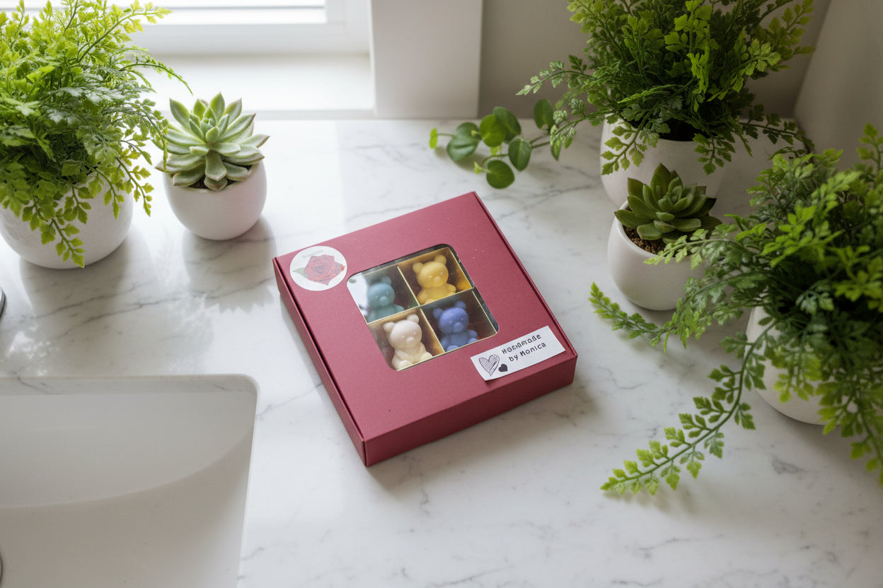 Mini soap bear boxset closed on a marble tabletop next to the sink with all around plants