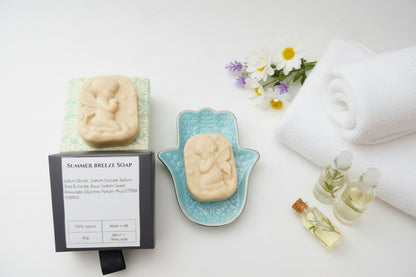 Summer Breeze Soap product shown with its black retail box, a carved pale beige soap bar resting on a light blue patterned dish, and the soap box.