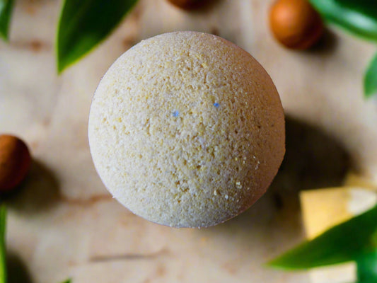 vanilla rounded yellow bath bomb with leaves and orages